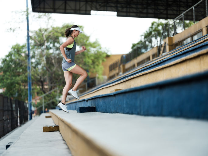determined athlete running stairs