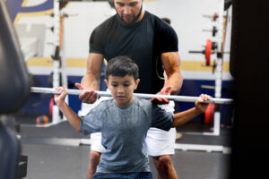 helping youth lift weights