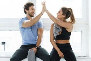 high five between trainer and client