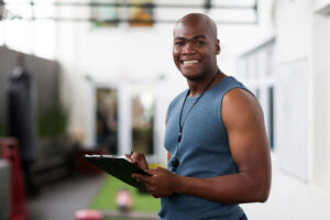 personal trainer with clipboard