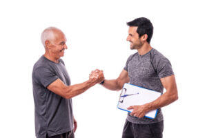 shaking hands with trainer after workout